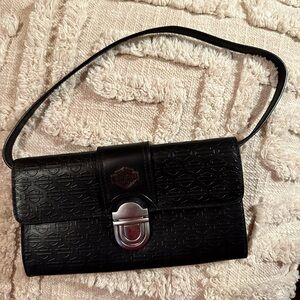 Harley Davidson embossed leather clutch w/detachable strap in perfect condition